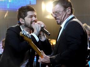 J.D. Fortune and Tim Farriss of INXS perform on stage at the Sound Academy in Toronto, Ont. (Dominic Chan/WENN.com)