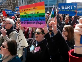 Demonstrators gather at Monument Circle to protest a controversial religious freedom bill recently signed by Governor Mike Pence during a rally in Indianapolis March 28, 2015.  More than 2,000 people gathered at the Indiana State Capital Saturday to protest Indiana�s newly signed Religious Freedom Restoration Act saying it would promote discrimination against individuals based on sexual orientation.  REUTERS/Nate Chute