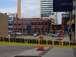 Winnipeg police taped off a section of Hargrave Street, which remained closed to traffic just before noon on Wednesday, April 1, 2015, after they say a woman was assaulted near a parking lot there around 5 a.m.