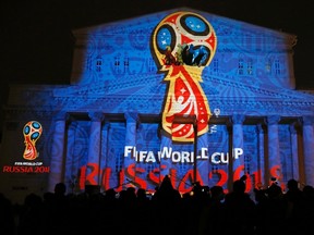 A light installation displays the official logotype of the 2018 FIFA World Cup during its unveiling ceremony at the Bolshoi Theater building in Moscow on October 28, 2014. (REUTERS/Maxim Shemetov)