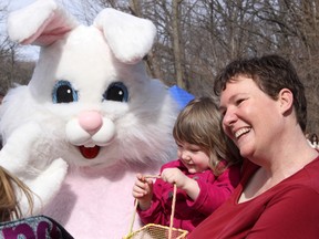 Victoria Mitchell and Samantha Maclean smile with the Easter Bunny at Canatara Park in Sarnia, Ont. in this file photo taken during a previous Easter in the Park. This year's egg hunt, and other family events, is set for Saturday, 9 a.m. to 12:30 p.m.
 File photo/Sarnia Observer/QMI Agency
