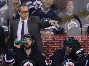 Head coach Paul Maurice of the Winnipeg Jets gestures from the bench in third period action in an NHL game against the New York Rangers at MTS Centre on March 31, 2015 in Winnipeg, Manitoba, Canada.