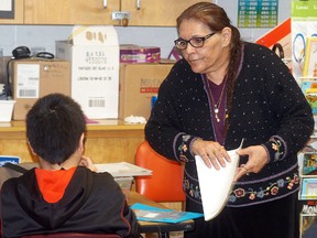 Rhonda Longboat instructs a Walpole Island Elementary School student in the native art of beading.