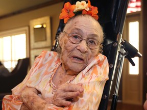 In this Thursday, July 3, 2014 photo, Gertrude Weaver poses at Silver Oaks Health and Rehabilitation Center in Camden, Ark., a day before her 116th birthday. The Gerontology Research Group says Weaver is the oldest person in the United States and second-oldest person in the world. (AP/Danny Johnston)