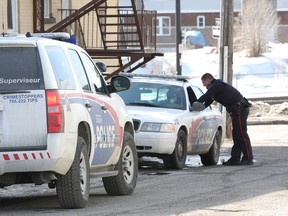Greater Sudbury Police investigate an assault at a residence on Fir Lane in Sudbury, Ont. on Wednesday April 1, 2015. Police are asking for the public`s assistance in obtaining information on an altercation that would have occurred inside the victim`s residence sometime between Tuesday evening and Wednesday morning. John Lappa/Sudbury Star/QMI Agency