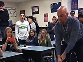 A viral video apparently shows a physics teacher taking an axe to the jewels in a classroom experiment gone wrong. (YouTube)