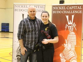 Sudbury's Sarra Gratton (right) poses with master Chris Fortin after winning the black belt sparring title at the Nickel Capital Budo Challenge.
