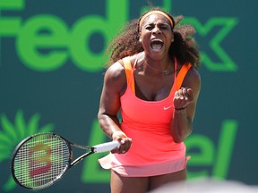 Serena Williams celebrates after winning a point against Sabine Lisicki (not pictured) on day ten of the Miami Open at Crandon Park Tennis Center. Williams won 7-6 (4), 1-6, 6-3.  Geoff Burke-USA TODAY Sports