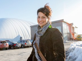 Anita Harnden, co-owner of the Kingston 1000 Islands Sportsplex in Westbrook, poses for a photo outside the dome on Wednesday. (Julia McKay/The Whig-Standard)