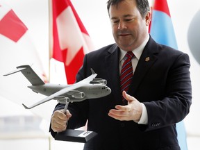 Minister of National Defence Jason Kenney is presented with a replica of a C-17 Globemaster during a ceremony at CFB Trenton, March 30, 2015.  (JEROME LESSARD/QMI Agency)