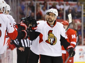 Ottawa Senators left wing Clarke MacArthur (16) receives congratulations from teammates after scoring in the third period against the Detroit Red Wings at Joe Louis Arena on Mar 31, 2015 in Detroit, MI, USA. (Rick Osentoski/USA TODAY Sports)