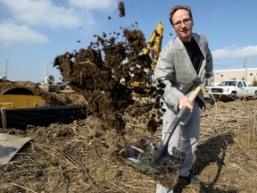 Andrew Sharpe, president of hi-tech, high-speed camera maker IO Industries, breaks ground on the new location for his company?s office in an east London industrial park on Wednesday. (ANDREW LAHODYNSKYJ/ Special to The Free Press)