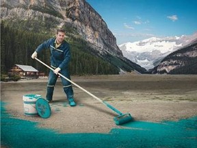 A fictitious image of a worker painting Lake Louise Blue sent out by Travel Alberta for April Fool's Day.