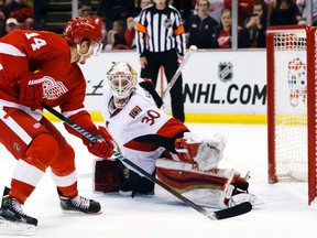 Detroit Red Wings center Gustav Nyquist (14) scores a shootout goal on Ottawa Senators goalie Andrew Hammond (30) at Joe Louis Arena on Mar 31, 2015 in Detroit, MI, USA. (Rick Osentoski/USA TODAY Sports)