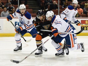 Jordan Eberle tangles with Ducks forward Andrew Cogliano during first period action Wednesday in Anaheim. (USA TODAY SPORTS)