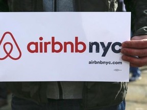 A supporter of Airbnb holds a sign during a rally before a hearing called ''Short Term Rentals: Stimulating the Economy or Destabilizing Neighborhoods?'' at City Hall in New York January 20, 2015. Reuters/Shannon Stapleton