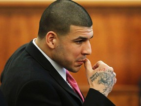 Former New England Patriots football player Aaron Hernandez sits during his murder trial at Bristol County Superior Court in Fall River, Mass., April 2, 2015. (REUTERS/Steven Senne/Pool)