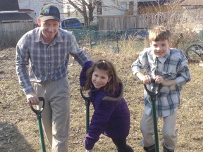 Jason Schwartzentruber and his children Evy, 8, and Adam, 6, took part in a recent ground-breaking ceremony for a home on Euphemia Street North in Sarnia volunteers with Habitat for Humanity Sarnia-Lambton are set to build for the family. (Handout/Sarnia Observer/QMI Agency)