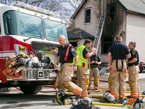 Belleville firefighters respond to a house fire at 13 Greene St. in Belleville on Thursday, April 2. - Tim Miller/The Intelligencer