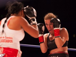 Jelena Mrdjenovich, shown here in the ring with challenger Marilyn Hernandez last September, defended her title with a victory over Francia Elena Bravo last Friday in Pansama City, Panama. (Chad Steeves, Edmonton Sun)