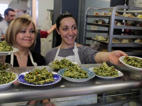 Anne Hopkins (L) and Sophie Cormier (R) Hoteliers that Have Heart members from Hotel Indigo, dished out some delicious pasta to the 350 guests that passed through Shepherds of Good Hope on April 2. (DYLAN CONWAY-HARTWICK/OTTAWA SUN)