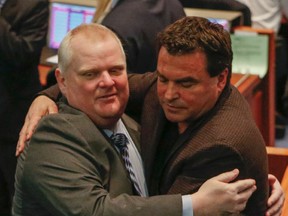 Councillor Giorgio Mammoliti hugs Rob Ford after word that Ford can have surgery for his cancer Thursday April 2, 2015. (Dave Thomas/Toronto Sun)