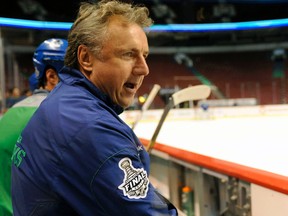 Rick Bowness on the bench at the Vancouver Canucks practice at Rogers arena in Vancouver on Monday May 30th 2011. (ERIC BOLTE/QMI AGENCY)