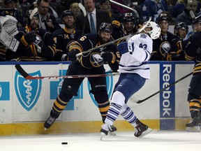 Sabres’ Mike Weber high sticks Maple Leafs’ Nazem Kadri during their game at First Niagara Center in Buffalo on Wednesday. The Leafs lost, putting the Sabres’ apparent quest to secure the first overall pick in the NHL draft in jeopardy. (USA TODAY SPORTS/PHOTO)