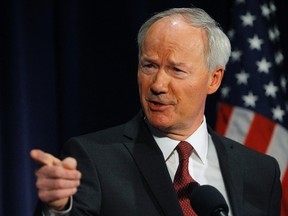 Former Rep. Asa Hutchinson, a consultant of the National Rifle Association, discusses the findings and recommendations of the National School Shield Program at the National Press Club in Washington in this April 2, 2013, file photo. Republican Arkansas Governor Asa Hutchinson rejected a religion bill he had said he would sign into law, reversing course after a firestorm of criticism assailing such legislation as discriminating against gays and lesbians, on April 1, 2015.   REUTERS/Gary Cameron/Files