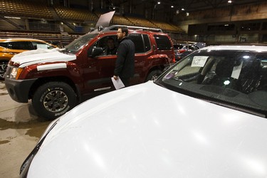 Integrated Automotive Experience staff prep vehicles for the wash bays during setup for the 2015 Edmonton Motorshow at Edmonton Expo Centre in Edmonton, Alta., on Thursday, April 2, 2015. The show runs from April 9 to 12, 2015. The Precious Metal Gala is on April 8 at 6:30 p.m. Ian Kucerak/Edmonton Sun/ QMI Agency
