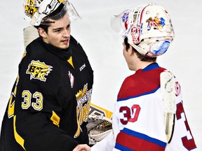 Edmonton's Tristan Jarry shakes hands with Brandon's Jordan Papirny during overtime of the Edmonton Oil Kings' WHL playoff hockey game against the Brandon Wheat Kings at Rexall Place in Edmonton, Alta., on Wednesday, April 1, 2015. The Wheat Kings won 3-2, ending the playoffs for the Oil Kings. Codie McLachlan/Edmonton Sun