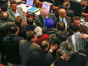 Councillor Rob Ford is surrounded by taxi drivers in City Hall council chamber on Thursday April 2, 2015. (Dave Thomas/Toronto Sun)