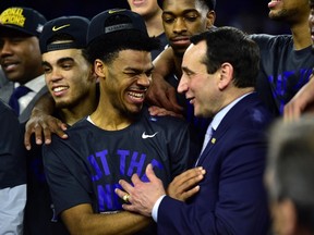 Duke Blue Devils head coach Mike Krzyzewski congratulates a player after winning their regional final. (USA TODAY SPORTS)