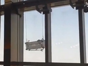 A video out of Shanghai, China shows two window cleaners caught in a windstorm 91 floors up.