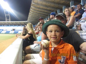 Joseph Kennedy is all smiles after retrieving a foul ball during a Granma Alazanes and Holguin Cacharros in Holguin, Cuba. As per the tradition, the ball was returned to the playing field. 
Photo Lorraine Kennedy