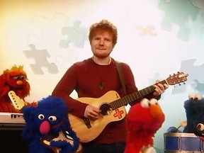 Ed Sheeran performs with some Sesame Street characters. (YouTube screengrab)
