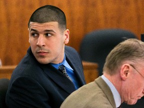 Former NFL player Aaron Hernandez looks over his shoulder during his murder trial at the Bristol County Superior Court in Fall River, Mass., on March 23, 2015. (REUTERS/Dominick Reuter/Pool)