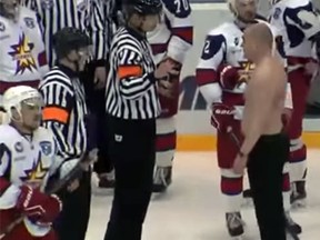 Pro hockey coach Andrei Razin ends up without a shirt after a bloody fight on Thursday. (YouTube screen grab)