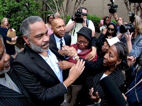 Anthony Ray Hinton is greeted by family outside the Jefferson County Jail in Birmingham, Ala., on April 3, 2015. Hinton, 59, walked out of the jail a free man on Friday morning after almost 30 years on death row in Alabama for a crime he did not commit. (REUTERS/Marvin Gentry)
