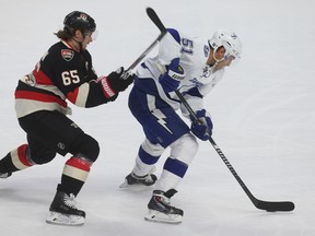 Ottawa Senators Erik Karlsson tries to chase down Tampa Bay Lightning forward Valtteri Filppula during first period action at the Canadian Tire Centre in Ottawa Thursday April 2, 2015.  
Tony Caldwell/Ottawa Sun/QMI Agency