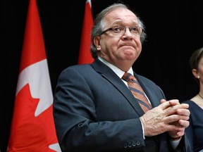 Canada's Aboriginal Affairs Minister Bernard Valcourt  take part in a news conference following the National Roundtable on Missing and Murdered Indigenous Women and Girls in Ottawa February 27, 2015. REUTERS/Chris Wattie