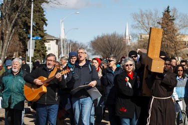 Patricipants sing during the 35th annual Outdoor Way of the Cross in Edmonton, Alta., on Friday, April 3, 2015. Organizers said 900 people participated in eight stations of the Cross, on Good Friday. Ian Kucerak/Edmonton Sun/ QMI Agency