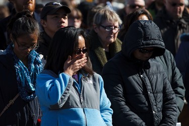 People react as Sharon Pasula addressed justice and reconciliation for indigenous peoples in front of Ambrose Place during the 35th annual Outdoor Way of the Cross in Edmonton, Alta., on Friday, April 3, 2015. Organizers said 900 people participated in eight stations of the Cross, on Good Friday. Ian Kucerak/Edmonton Sun/ QMI Agency
