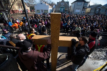 The Cross is seen in front of the Boyle McCauley Health Centre during the 35th annual Outdoor Way of the Cross in Edmonton, Alta., on Friday, April 3, 2015. Organizers said 900 people participated in eight stations of the Cross, on Good Friday. Ian Kucerak/Edmonton Sun/ QMI Agency
