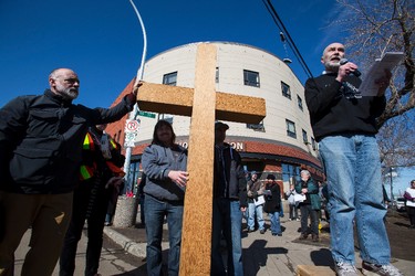 Way of the Cross Planning Committee member Jim Grunett speaks in front of Hope Mission during the 35th annual Outdoor Way of the Cross in Edmonton, Alta., on Friday, April 3, 2015. Organizers said 900 people participated in eight stations of the Cross, on Good Friday. Ian Kucerak/Edmonton Sun/ QMI Agency
