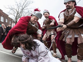 St. Francis of Assisi Catholic Church held its annual Good Friday Stations of the Cross procession down College St. in Little Italy on Friday.
(CRAIG ROBERTSON, Toronto Sun)