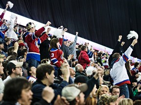 Fans celebrate an Oil Kings goal during the second period of the Edmonton Oil Kings' WHL playoff hockey game against the Brandon Wheat Kings at Rexall Place in Edmonton, Alta., on Sunday, March 29, 2015. Codie McLachlan/Edmonton Sun