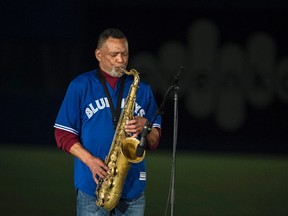 Russell Martin Sr. performs the national anthems at Olympic Stadium in Montreal on Friday night ahead of the Blue Jays-Reds spring training game. (QMI AGENCY/PHOTO)