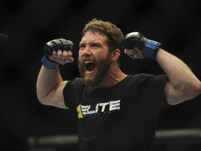 Mitch Clarke celebrates his win by submission against opponent Al Laquinta during their UFC 173 lightweight bout. (Stephen R. Sylvanie/USA TODAY Sports)