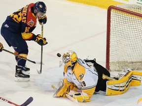 Sarnia Sting goalie Taylor Dupuis makes a save on Alex DeBrincat of the Erie Otters in Game 5 of the OHL playoff series on April 3 at Erie Insurance Arena. (JACK HANRAHAN, Special to QMI Agency)